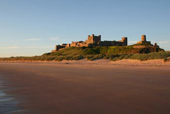 a view from the beach of bamburgh castle